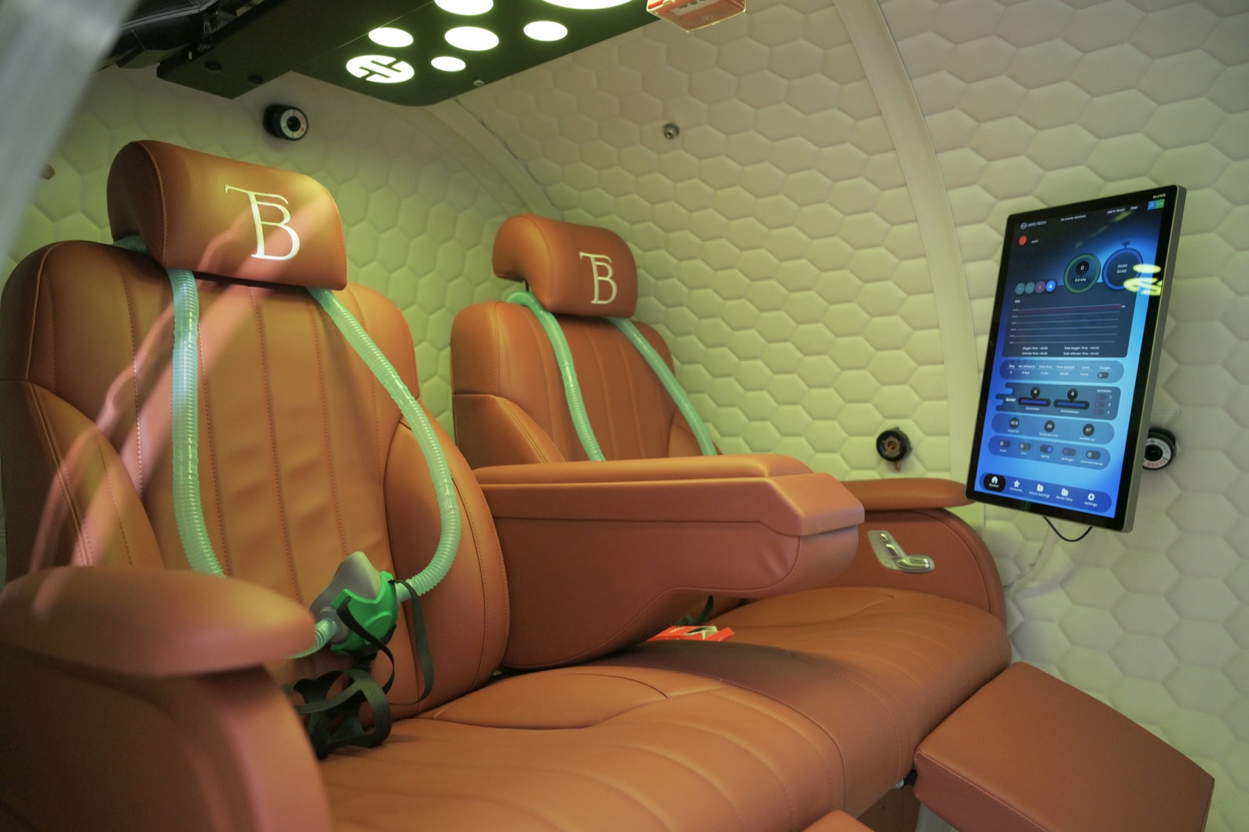 Leather seats and entertainment screen inside the chamber